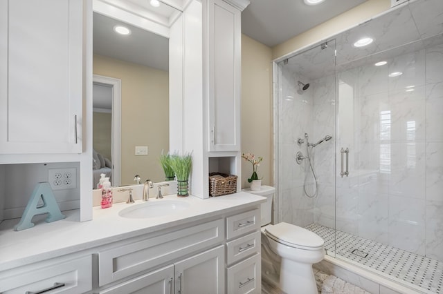 full bathroom with recessed lighting, a marble finish shower, toilet, and vanity