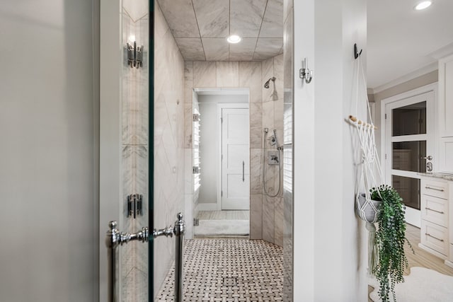 full bathroom with a tile shower and recessed lighting