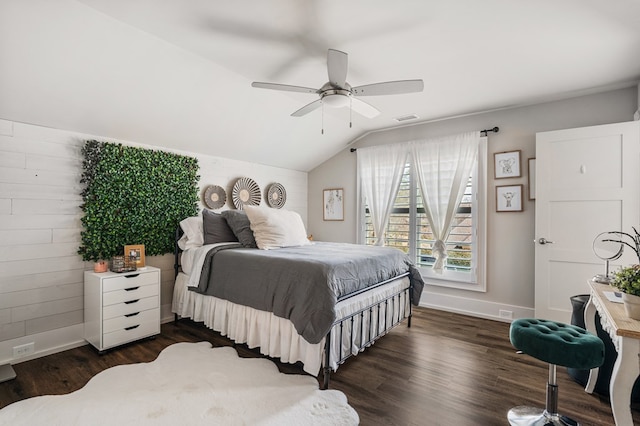 bedroom with a ceiling fan, baseboards, visible vents, dark wood finished floors, and lofted ceiling