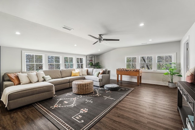 living room featuring visible vents, baseboards, vaulted ceiling, recessed lighting, and dark wood-style flooring