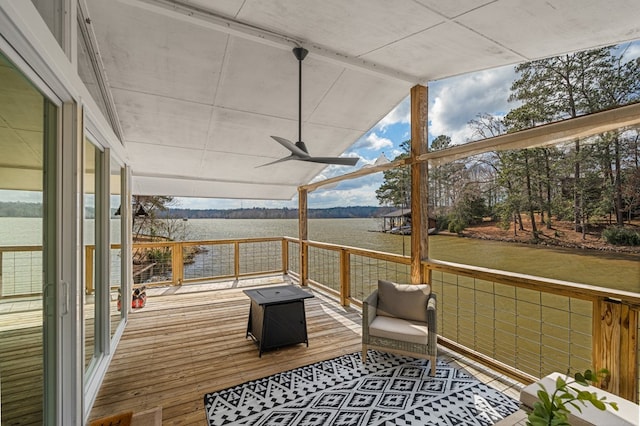 wooden terrace featuring a ceiling fan