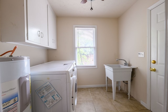 1820 Overlook St, Columbus, GA 31906 - laundry area with gas water heater, cabinet space, washing machine and clothes dryer, a ceiling fan, and light tile patterned floors