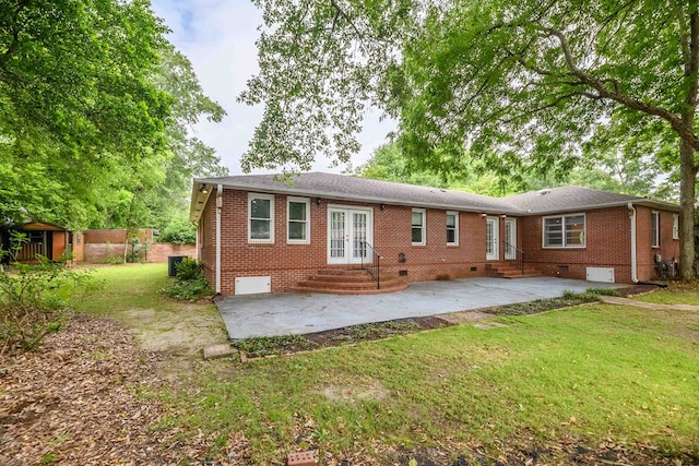 1820 Overlook St, Columbus, GA 31906 - back of house featuring french doors, entry steps, a patio, brick siding, and a yard