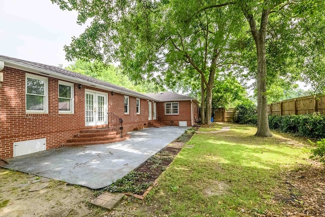1820 Overlook St, Columbus, GA 31906 - back of property with french doors, entry steps, a patio area, and brick siding