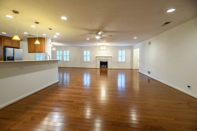 1820 Overlook St, Columbus, GA 31906 - unfurnished living room featuring a ceiling fan, dark wood-type flooring, recessed lighting, a fireplace, and a textured ceiling