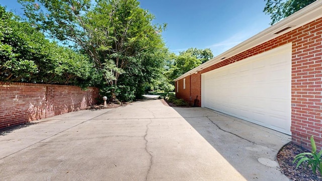1820 Overlook St, Columbus, GA 31906 - view of patio with a garage and driveway