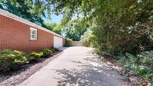 1820 Overlook St, Columbus, GA 31906 - view of yard featuring concrete driveway and an attached garage