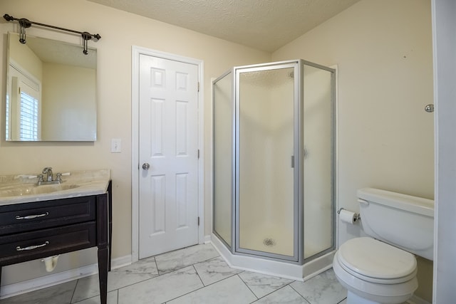 1820 Overlook St, Columbus, GA 31906 - full bathroom featuring vanity, a shower stall, marble look tile flooring, and a textured ceiling