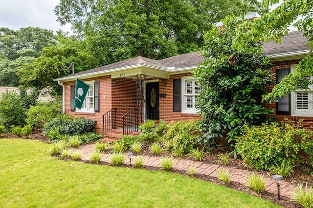 1820 Overlook St, Columbus, GA 31906 - view of front facade with brick siding, a front lawn, and roof with shingles