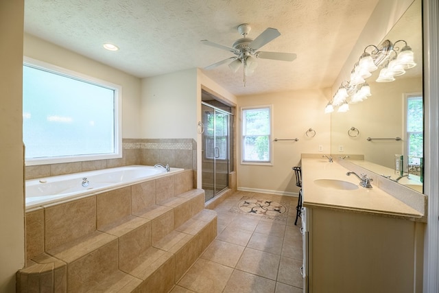 1820 Overlook St, Columbus, GA 31906 - full bathroom with a bath, double vanity, a shower stall, tile patterned flooring, and ceiling fan