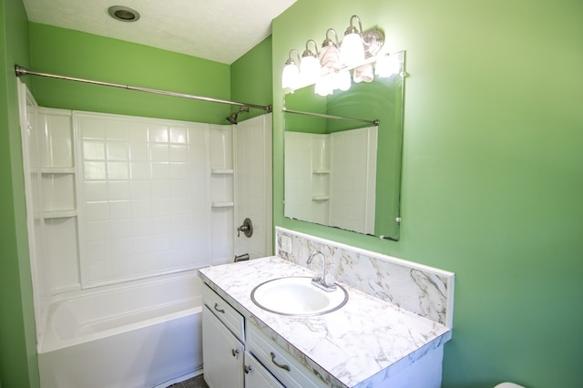 bathroom featuring vanity, shower / bathing tub combination, and a textured ceiling