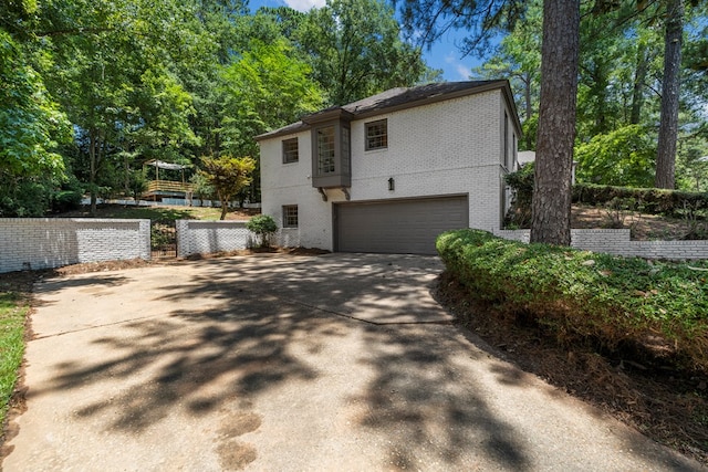 7172 Standing Boy Rd, Columbus, GA 31904 - view of side of property with brick siding, an attached garage, and driveway