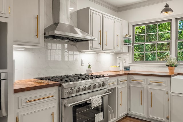 7172 Standing Boy Rd, Columbus, GA 31904 - kitchen featuring wall chimney exhaust hood, stainless steel stove, wood counters, crown molding, and tasteful backsplash