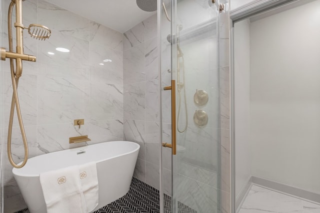 7172 Standing Boy Rd, Columbus, GA 31904 - bathroom with a shower stall, a freestanding tub, and marble look tiles