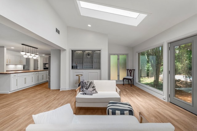 7172 Standing Boy Rd, Columbus, GA 31904 - living room featuring a skylight, light wood-style flooring, recessed lighting, and high vaulted ceiling