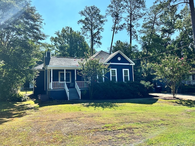 view of front of home featuring a front lawn and a porch