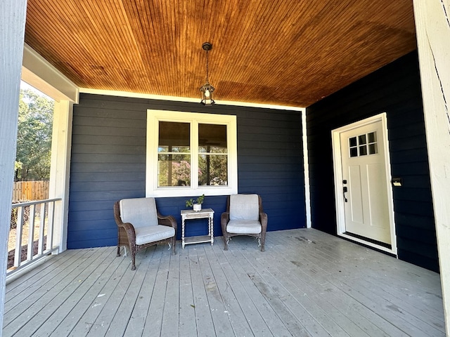 wooden terrace featuring covered porch