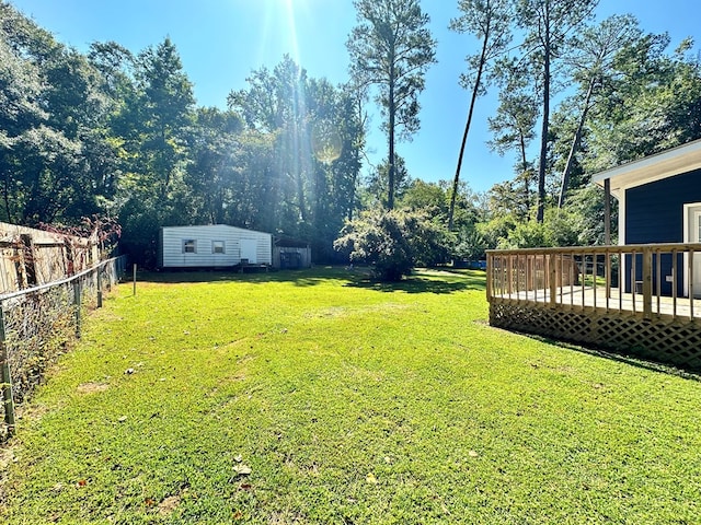 view of yard with a deck