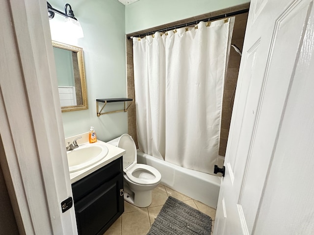 full bathroom featuring tile patterned flooring, shower / tub combo, vanity, and toilet