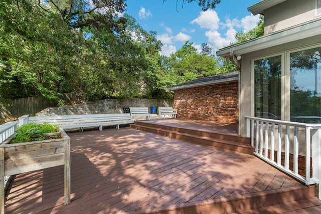 wooden deck featuring fence