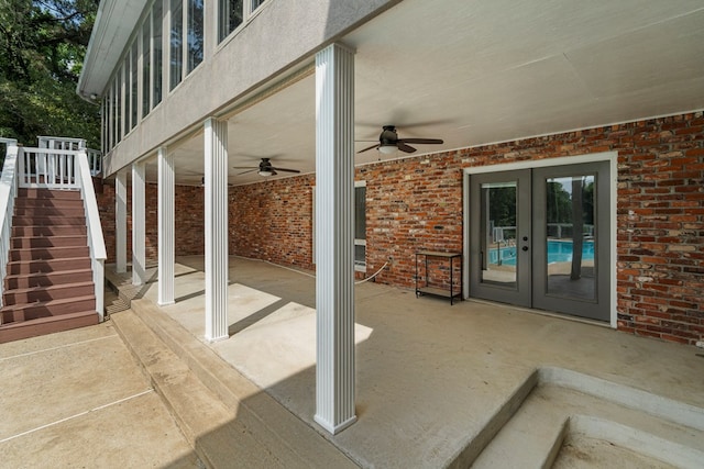view of patio / terrace with stairs, ceiling fan, and french doors