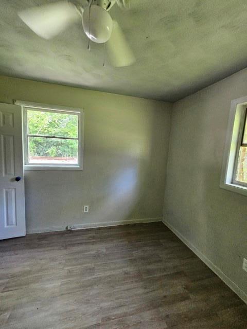 unfurnished room featuring hardwood / wood-style flooring