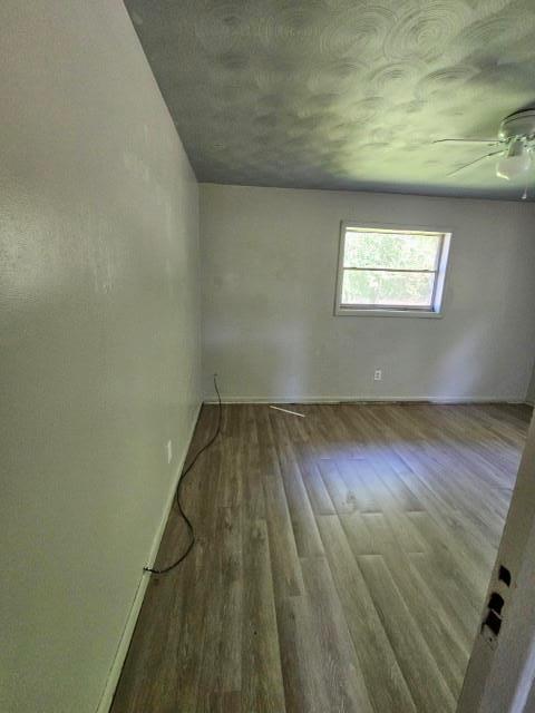 empty room with hardwood / wood-style flooring