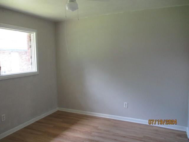 spare room with light hardwood / wood-style floors