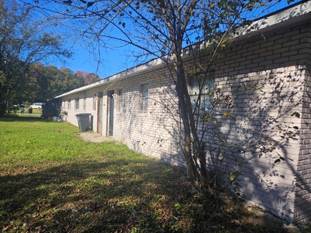 view of property exterior featuring a yard