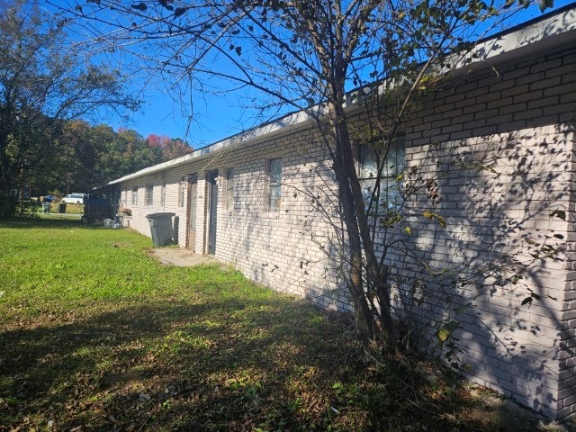 view of home's exterior featuring a lawn