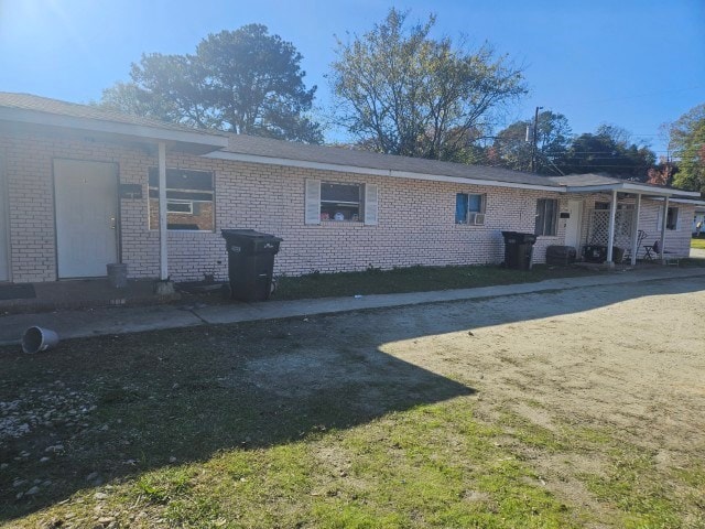 back of house featuring a yard