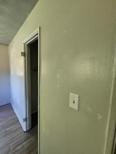 hallway featuring dark hardwood / wood-style floors