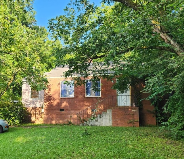 46 Infantry Dr, Columbus, GA 31903 - view of home's exterior with a yard, brick siding, and crawl space
