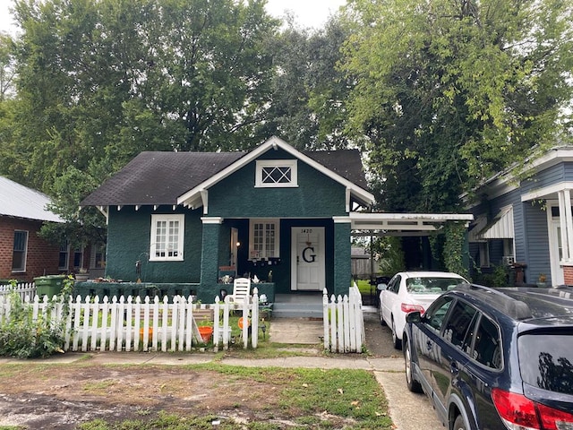 view of front facade with a carport