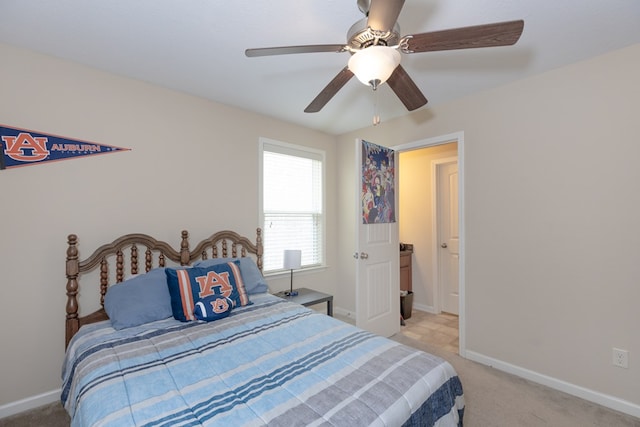 bedroom featuring baseboards, a ceiling fan, and light colored carpet