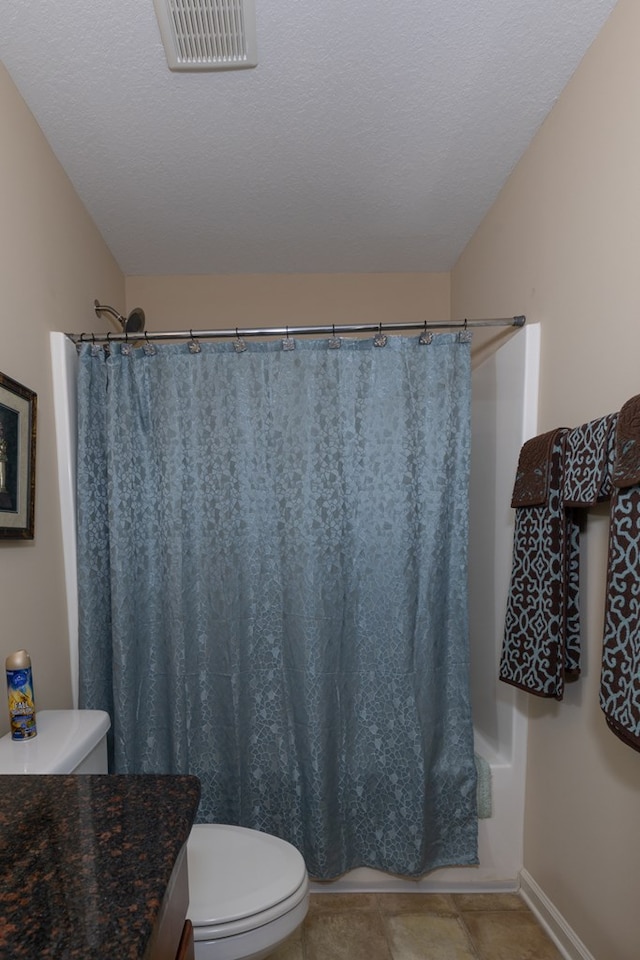 bathroom with visible vents, toilet, a shower with curtain, tile patterned floors, and a textured ceiling