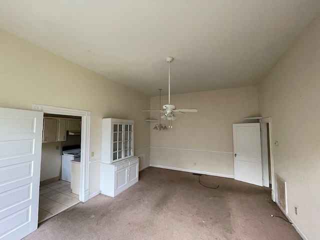 unfurnished room with light colored carpet, ceiling fan, and lofted ceiling