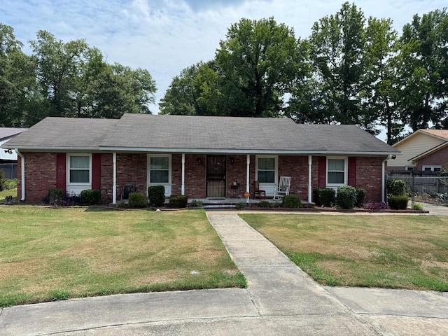 406 Henson Ave, Columbus, GA 31907 - view of front of home featuring brick siding, a porch, and a shingled roof