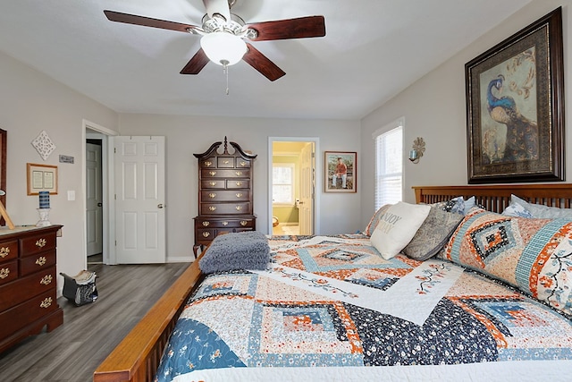 bedroom featuring connected bathroom, baseboards, ceiling fan, and wood finished floors