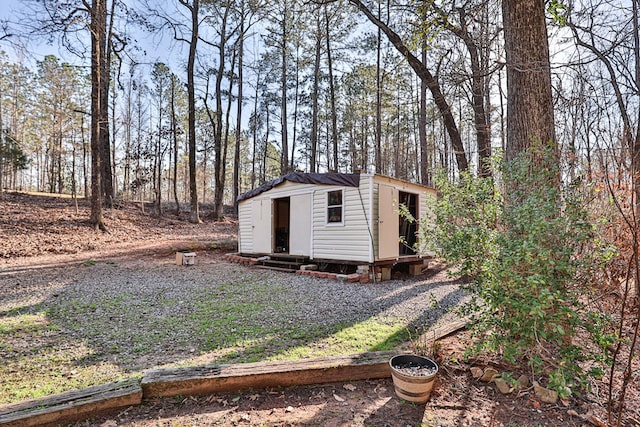 view of outdoor structure featuring an outbuilding and entry steps