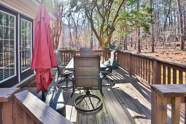 wooden deck with outdoor dining area