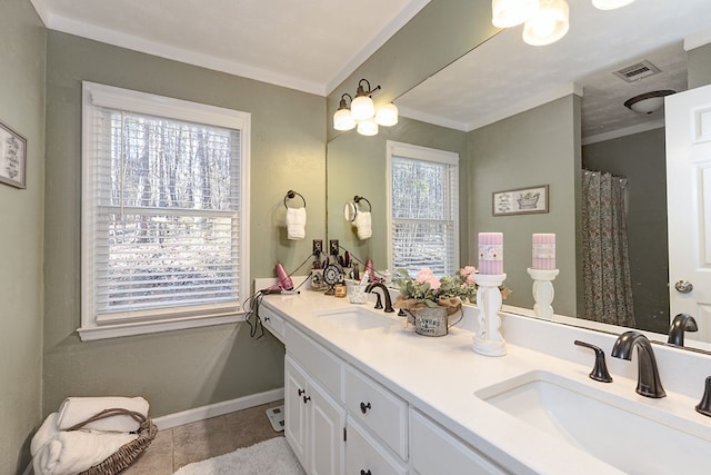 full bath featuring a sink, visible vents, baseboards, and ornamental molding