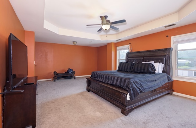 9 Red Maple St, Phenix City, AL 36869 - carpeted bedroom featuring baseboards, a raised ceiling, and a ceiling fan