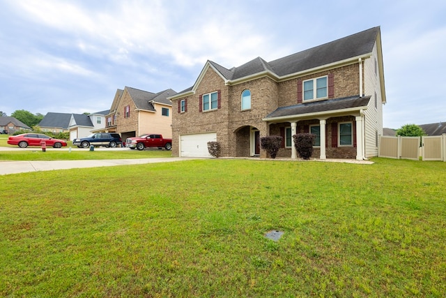 9 Red Maple St, Phenix City, AL 36869 - view of front of property featuring a garage, driveway, and brick siding