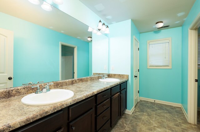 9 Red Maple St, Phenix City, AL 36869 - bathroom with double vanity and baseboards