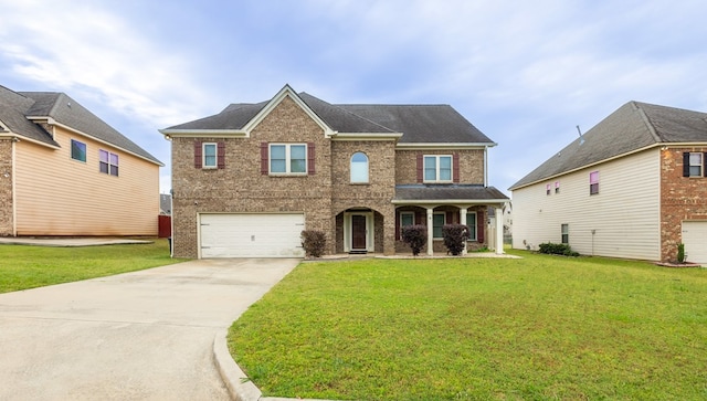 9 Red Maple St, Phenix City, AL 36869 - view of front facade featuring driveway, an attached garage, a front yard, and brick siding
