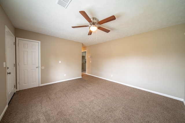 unfurnished room with carpet flooring, a textured ceiling, and ceiling fan