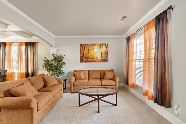 living room featuring visible vents, plenty of natural light, and crown molding