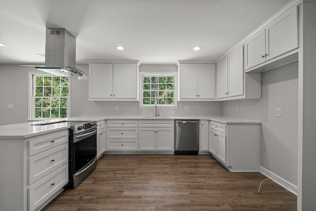 989 Lee Road 0213, Phenix City, AL 36870 - kitchen featuring appliances with stainless steel finishes, island range hood, a peninsula, plenty of natural light, and recessed lighting
