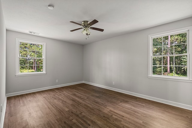 989 Lee Road 0213, Phenix City, AL 36870 - empty room featuring plenty of natural light, dark wood-style flooring, and a ceiling fan
